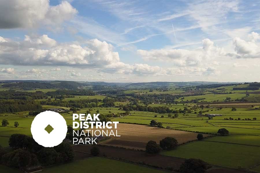 peakdistricportfolio Peak District landscape with the National Park logo