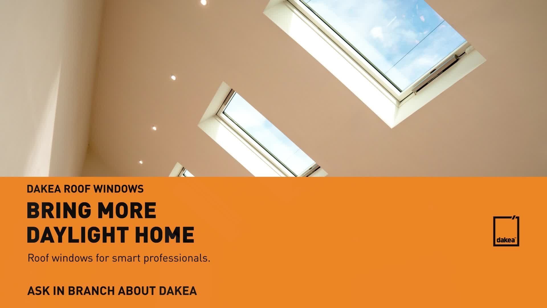 Dakea branded video production still Dakea roof-window campaign frame with orange branding and daylight photography