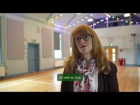 Village Green — film still Village Green film interview in a community hall